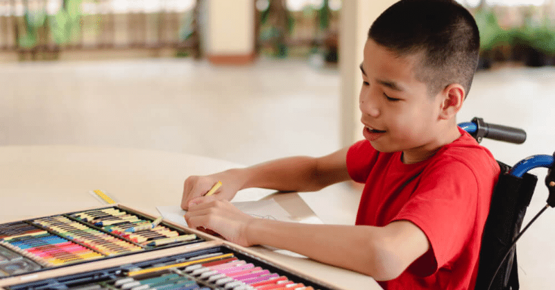disabled-child-in-wheelchair-painting-SEND-code-of-practice